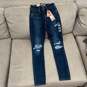 Distressed high rise skinny jeans